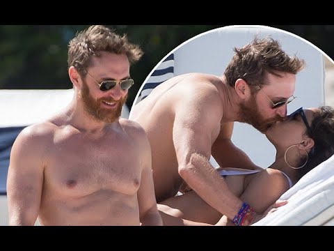 David Guetta displays his toned abs with bikini-clad girlfriend Jessica Ledon on the beach in Miami