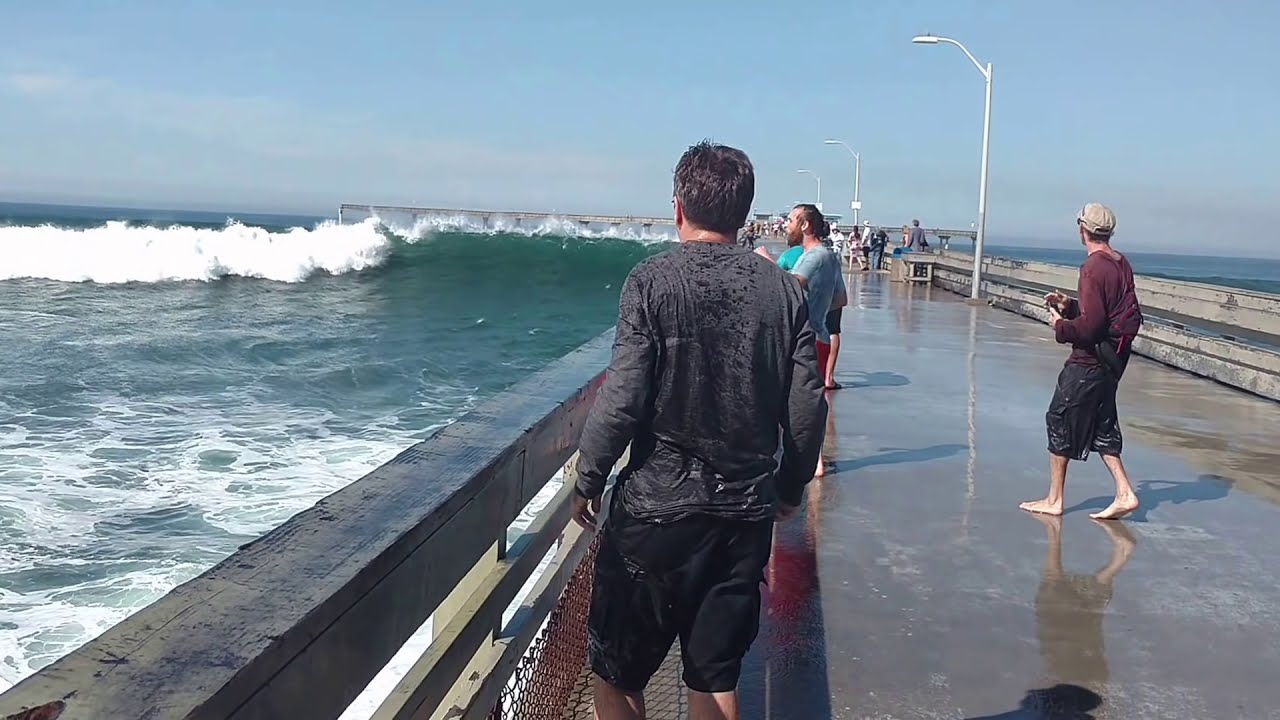Big wave wets tourist funny