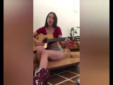 Scout Willis sings Trigger City while playing the guitar