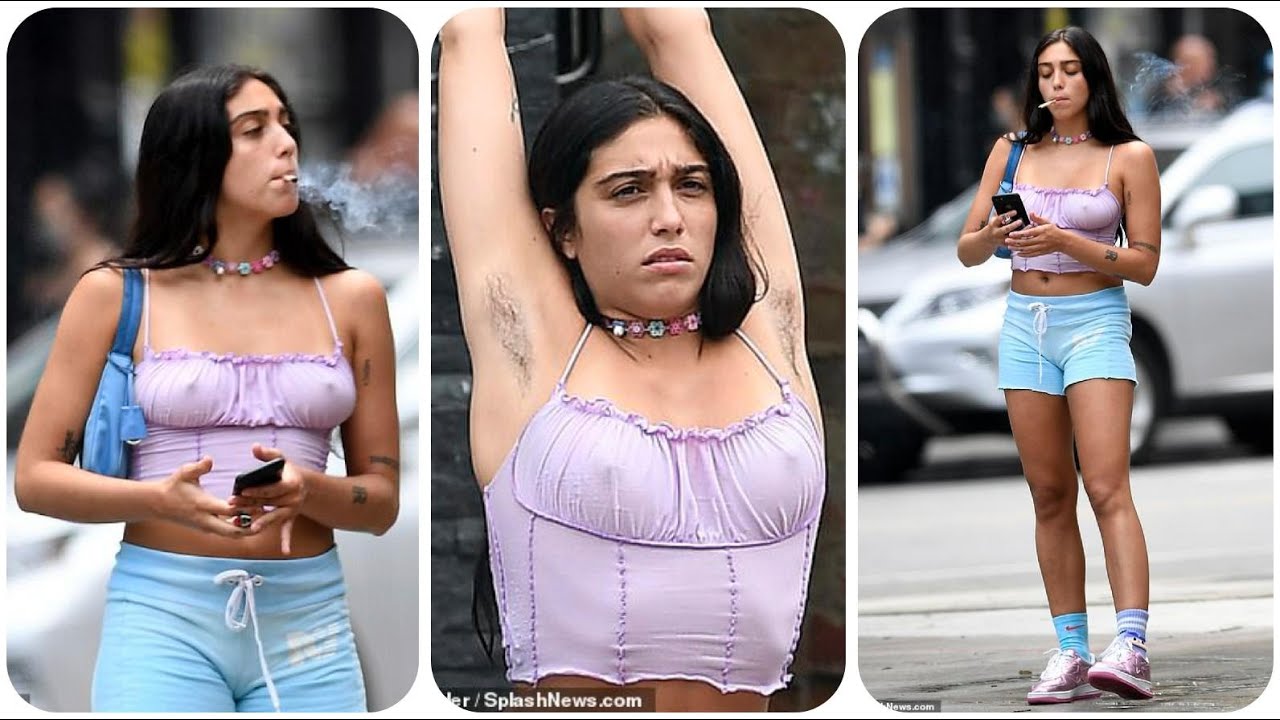 Madonna's daughter Lourdes Leon, braless and displays her unshaven armpits and smokes cigarettes