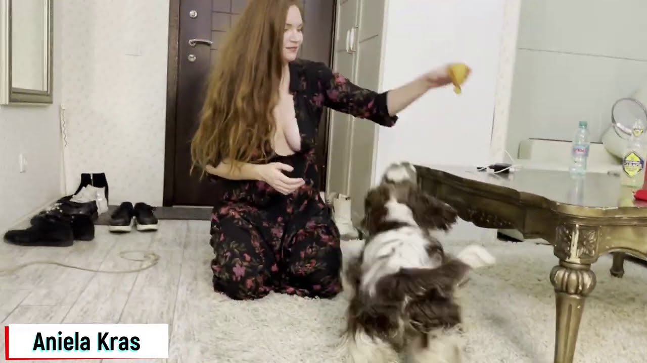 Aniela plays with her dog - downblouse