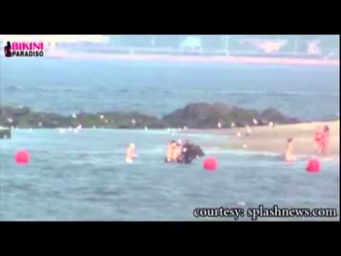 Hot Elizabeth Olsen and Dakota Fanning get pushed around by the waves