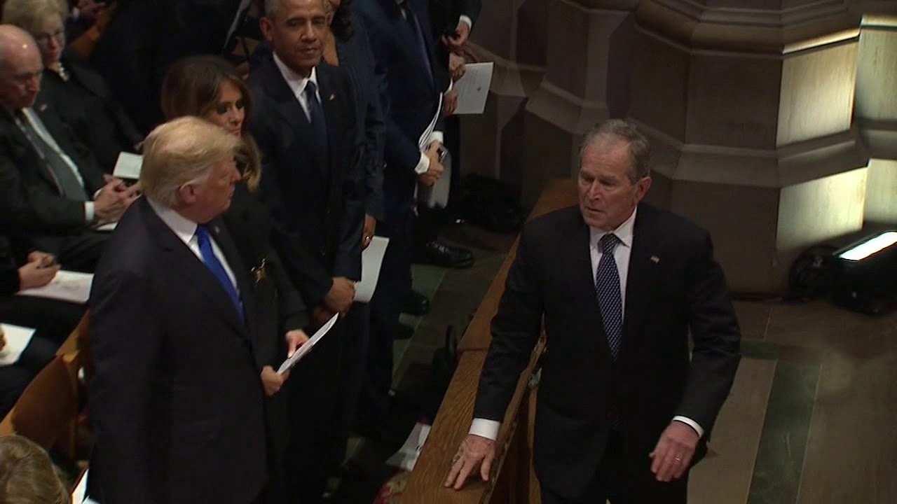 george-w-bush-sneaks-candy-to-michelle-obama-at-bush-funeral