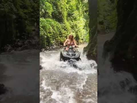 HANNAH PALMER rides an ATV through a waterfall in Bali #shorts
