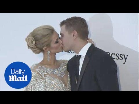 Sealed with a kiss! Paris Hilton and Chris Zylka at amfAR Gala - Daily Mail