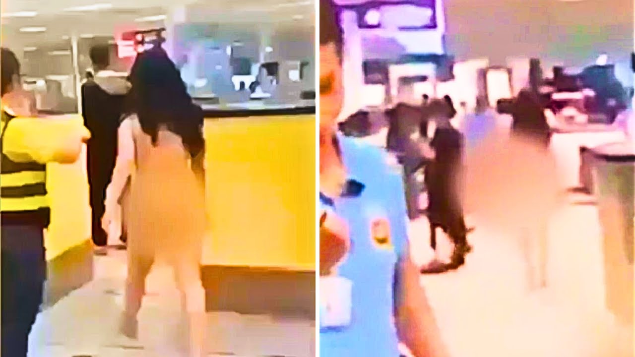 Woman struts naked through airport in wild scene