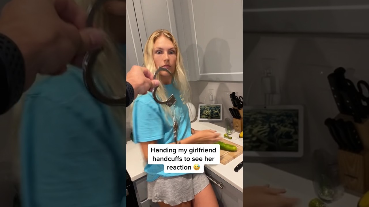 Handing my girlfriend handcuffs to see her reaction 