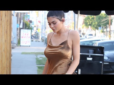 Kylie Jenner Shows Off Her Curves In Gold Dress