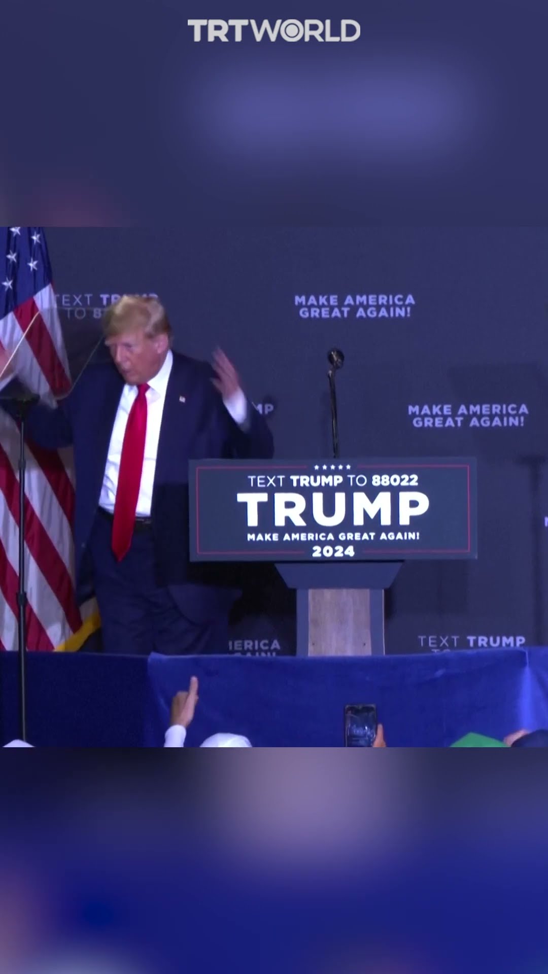 Trump mocks Biden by appearing clueless on stage