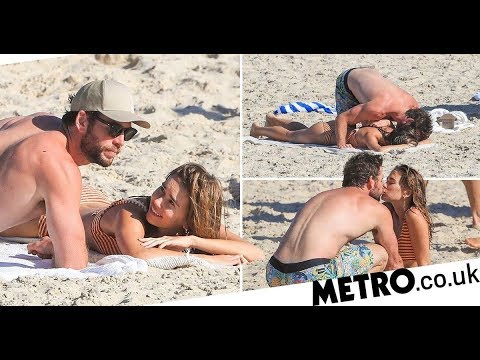 Liam Hemsworth can’t keep his hands off new girlfriend Gabriella Brooks during steamy beach PDA sesh
