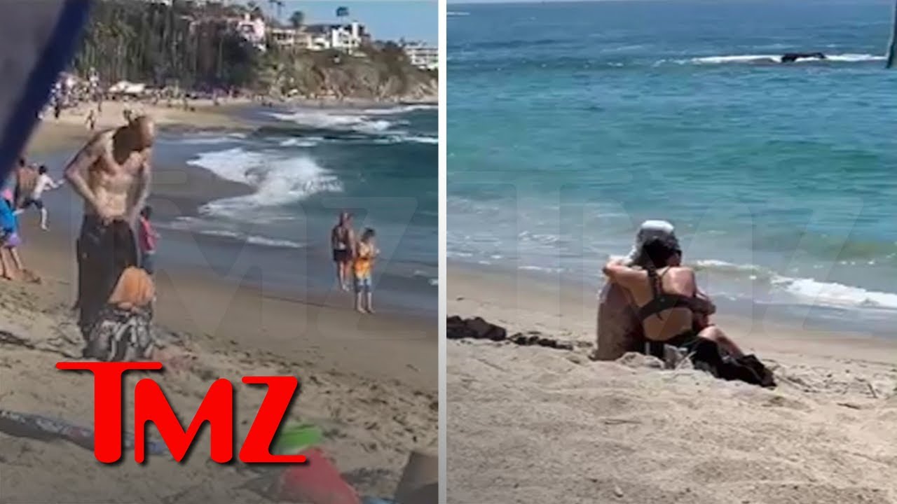 Kourtney Kardashian and Travis Barker Snuggle Up on Beach.