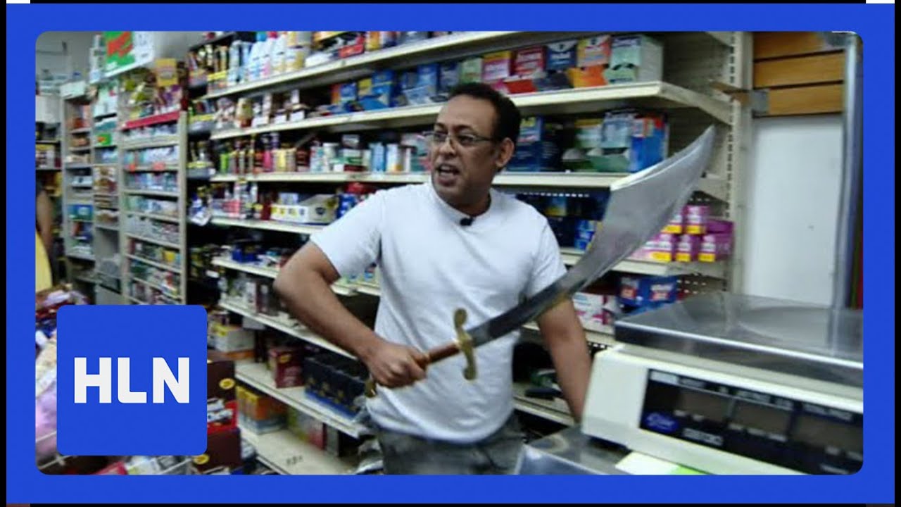 Robber pulls out machete; Clerk pulls out sword