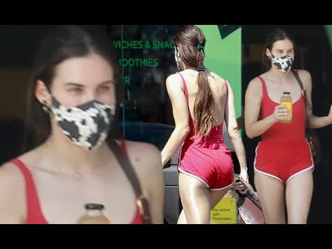 Scout Willis looks red hot in TINY crimson gym shorts and matching backless bodysuit as she beats th