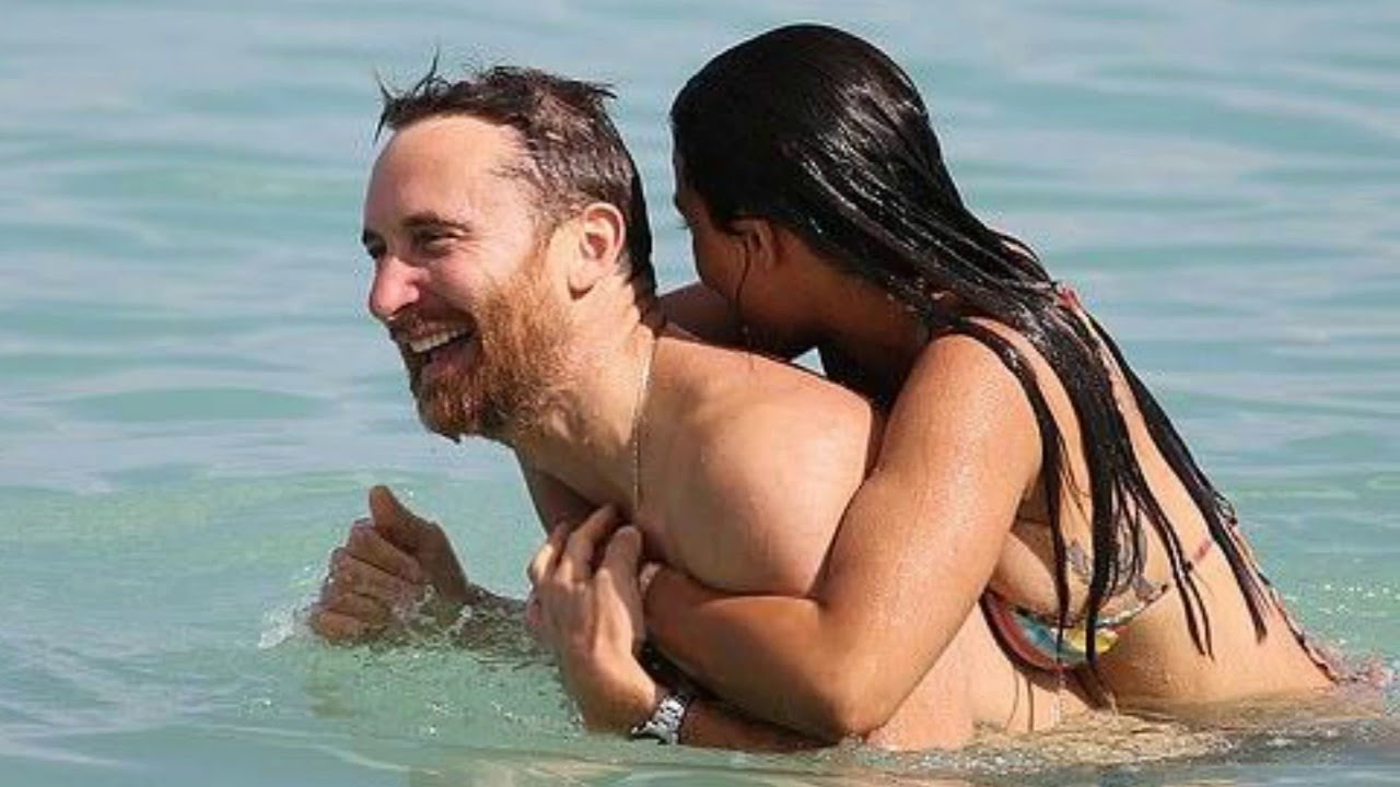 DJ David Guetta and bikini clad girlfriend enjoy Miami beach