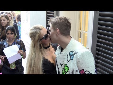 Paris Hilton and her boyfriend Chris Zylka share a tender kiss at the Philipp Plein Cruise Show 2018