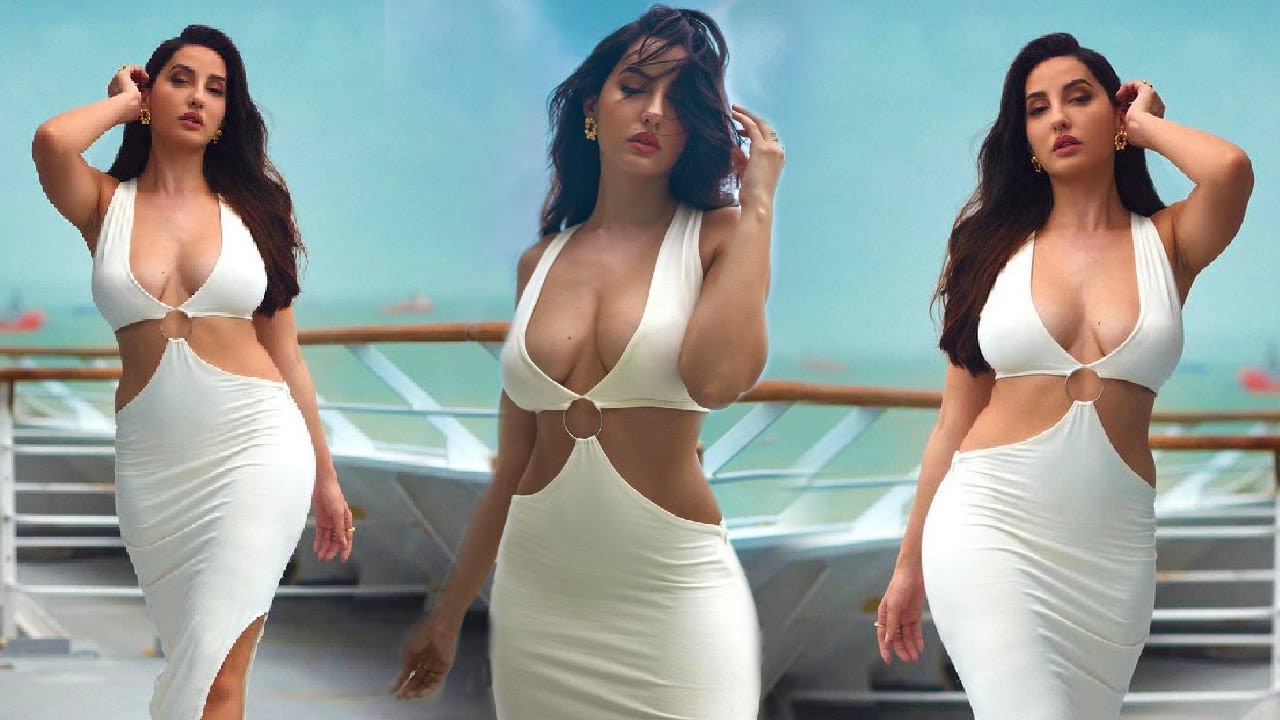 HOTT!E NORA FATEHİ SHOWİNG OFF HER DEEP CLEAVAGE AND LOOKİNG SUPER HOT IN HER WHİTE DRESS