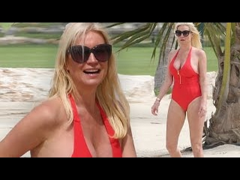 Red hot! Denise Van Outen in plunging swimsuit on Dubai holiday with her daughter Betsy